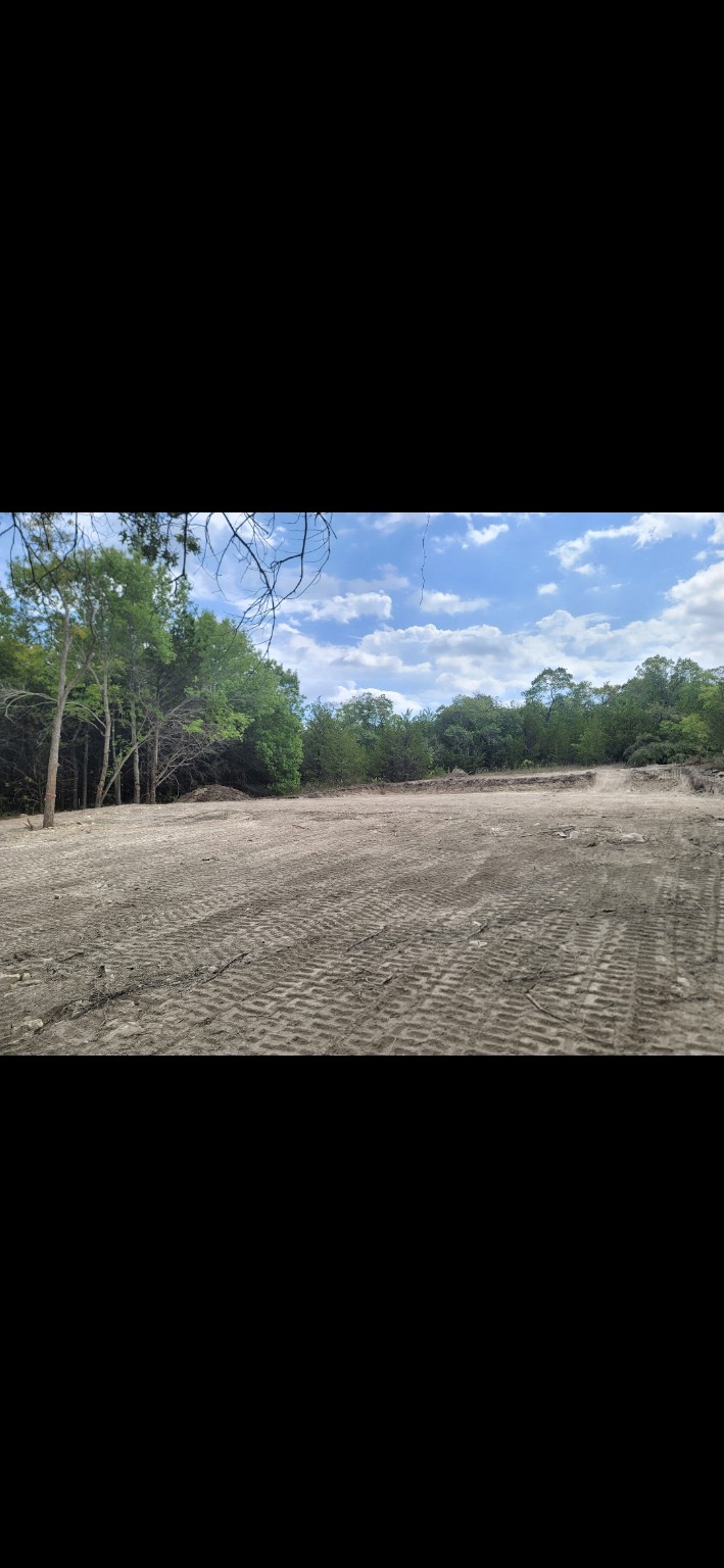 Cleared and graded rural building pad completed by Sadler